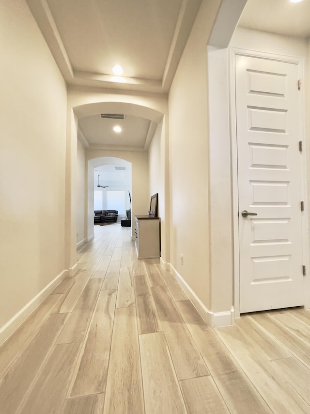 3237 Fennel Rd NE, Rio Rancho, NM 87144 - hallway featuring arched walkways, light wood finished floors, and recessed lighting