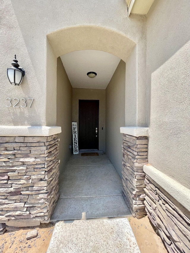 3237 Fennel Rd NE, Rio Rancho, NM 87144 - property entrance featuring stucco siding and stone siding