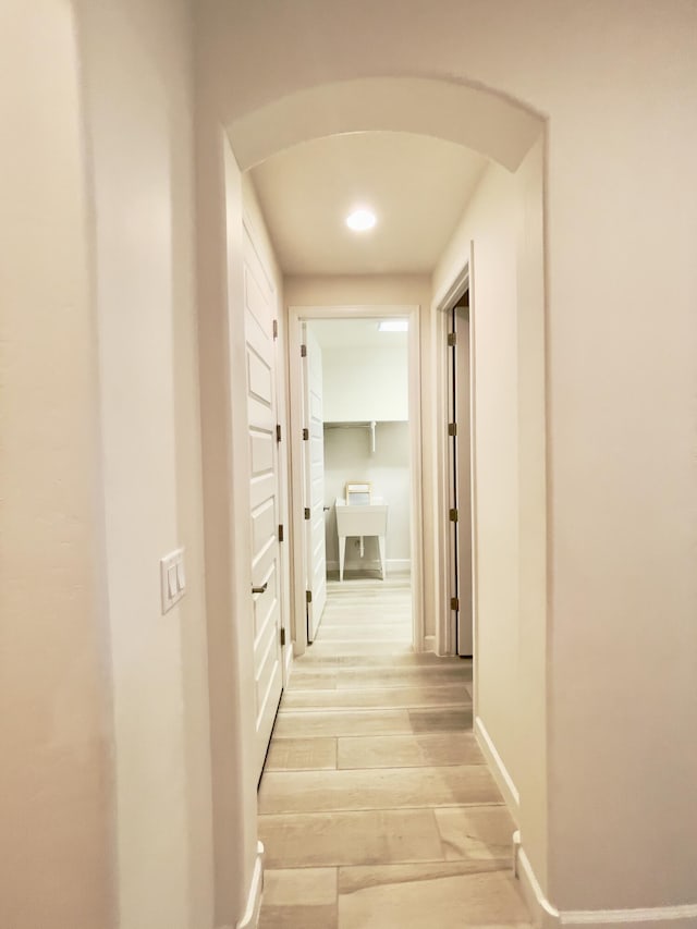 3237 Fennel Rd NE, Rio Rancho, NM 87144 - hall with recessed lighting, light wood-style floors, and arched walkways