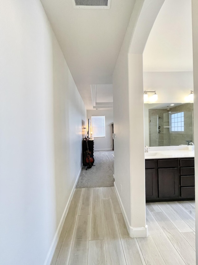 3237 Fennel Rd NE, Rio Rancho, NM 87144 - corridor with light wood-type flooring and plenty of natural light