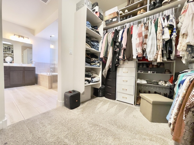 3237 Fennel Rd NE, Rio Rancho, NM 87144 - walk in closet with carpet flooring and tile patterned flooring