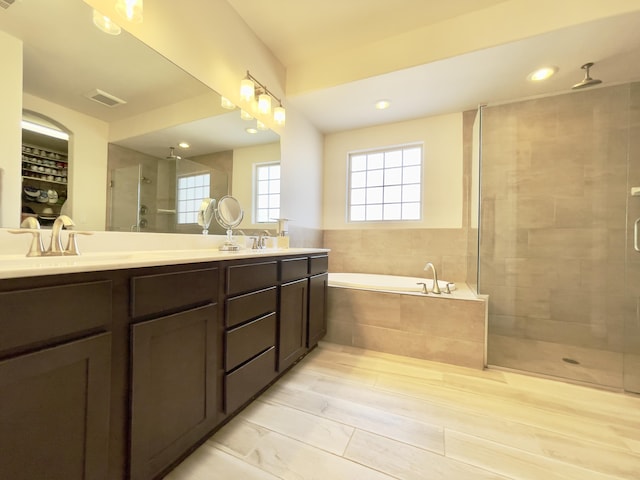 3237 Fennel Rd NE, Rio Rancho, NM 87144 - bathroom featuring a shower stall, double vanity, and a garden tub