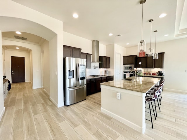 3237 Fennel Rd NE, Rio Rancho, NM 87144 - kitchen with stainless steel appliances, light wood finished floors, backsplash, and recessed lighting