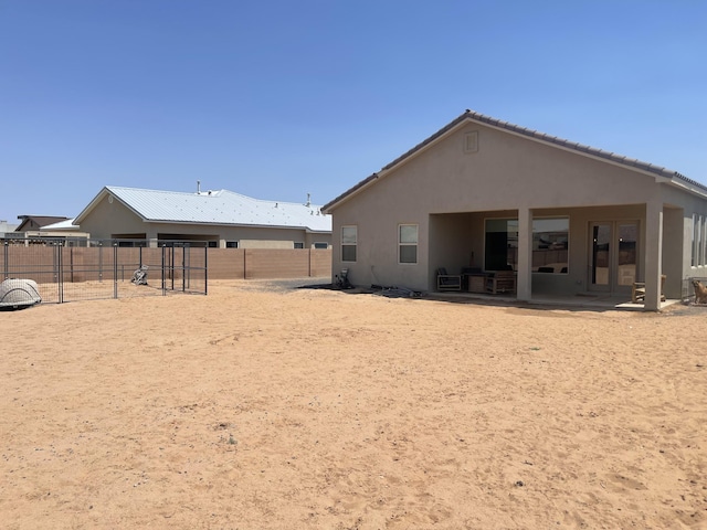 3237 Fennel Rd NE, Rio Rancho, NM 87144 - back of property featuring stucco siding and a patio