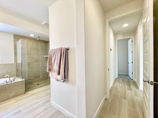 3237 Fennel Rd NE, Rio Rancho, NM 87144 - hallway with light wood finished floors and recessed lighting