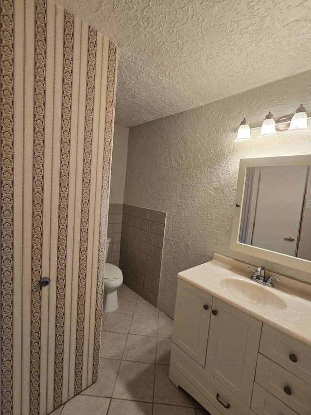 662 Avenida Perea, Bernalillo, NM 87004 - bathroom with a textured wall, a textured ceiling, vanity, and tile patterned flooring