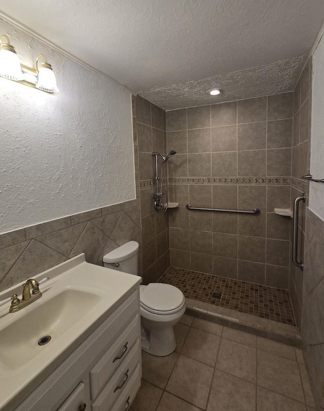 662 Avenida Perea, Bernalillo, NM 87004 - bathroom with tile walls, a textured ceiling, a shower stall, a textured wall, and vanity