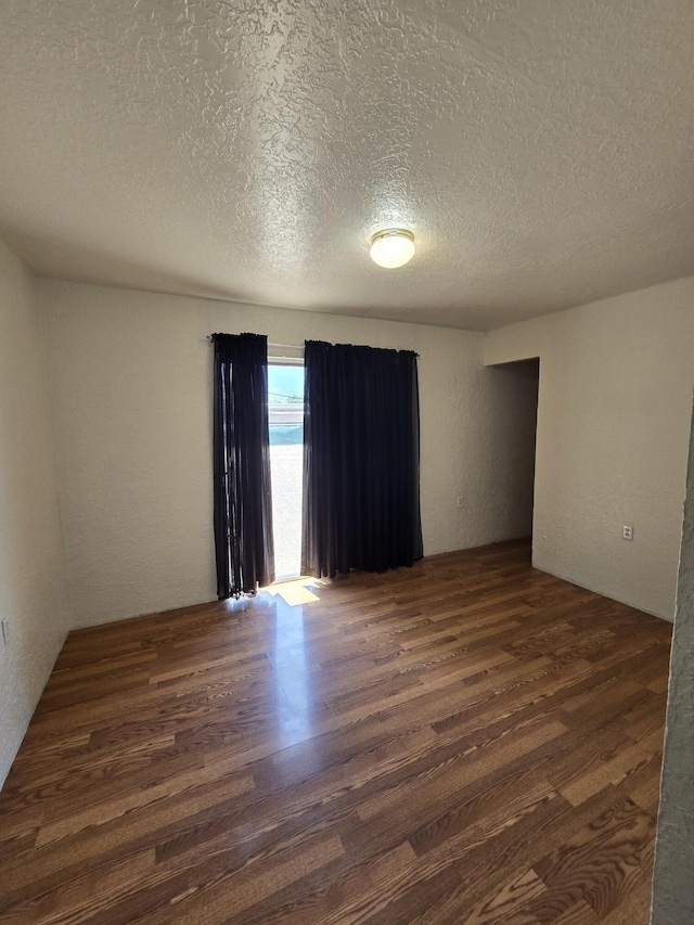 662 Avenida Perea, Bernalillo, NM 87004 - empty room featuring wood finished floors and a textured ceiling