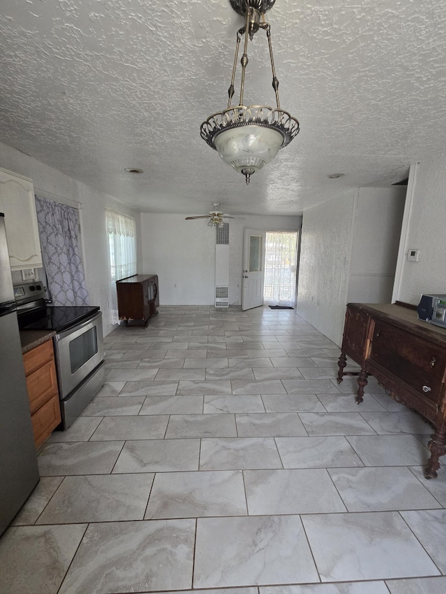 662 Avenida Perea, Bernalillo, NM 87004 - living room with plenty of natural light, a ceiling fan, and a textured ceiling