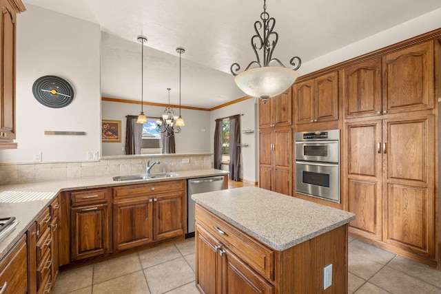 2632 Globe Ct NE, Rio Rancho, NM 87124 - kitchen featuring stainless steel appliances, brown cabinetry, light tile patterned floors, a chandelier, and crown molding