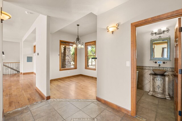 2632 Globe Ct NE, Rio Rancho, NM 87124 - foyer featuring light tile patterned floors and a chandelier