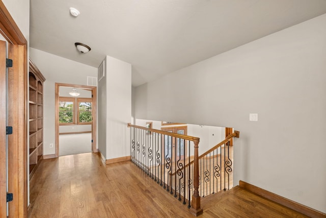 2632 Globe Ct NE, Rio Rancho, NM 87124 - hall featuring an upstairs landing and wood finished floors