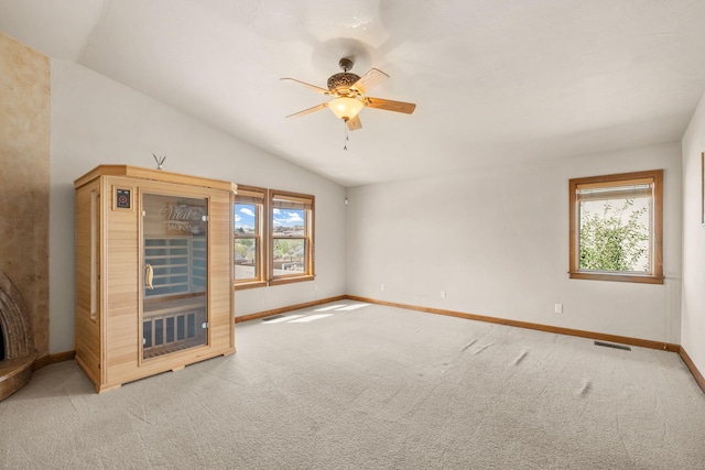 2632 Globe Ct NE, Rio Rancho, NM 87124 - unfurnished room with plenty of natural light, light carpet, ceiling fan, and vaulted ceiling