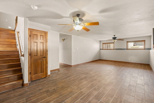 2632 Globe Ct NE, Rio Rancho, NM 87124 - unfurnished room with a ceiling fan, wood finished floors, and stairway