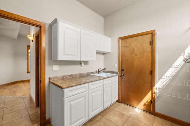 2632 Globe Ct NE, Rio Rancho, NM 87124 - kitchen featuring white cabinets and light tile patterned flooring