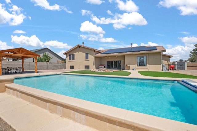 2632 Globe Ct NE, Rio Rancho, NM 87124 - view of swimming pool featuring a shed, a patio, a gazebo, and a fenced backyard