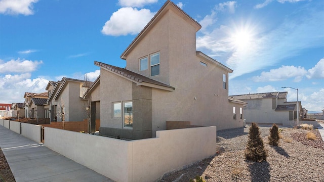 5623 Sagan Loop SE, Albuquerque, NM 87106 - view of home's exterior featuring stucco siding and a residential view