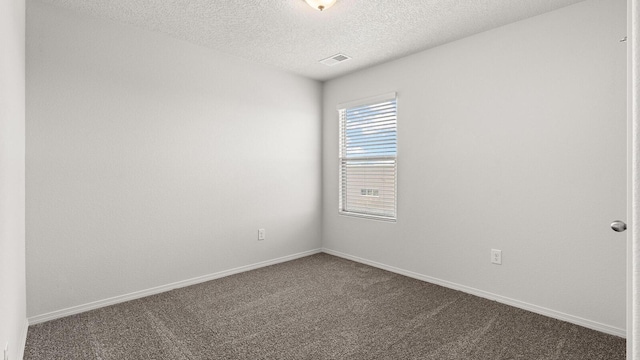5623 Sagan Loop SE, Albuquerque, NM 87106 - unfurnished room featuring dark carpet and a textured ceiling