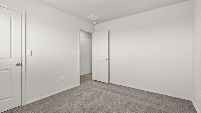 5623 Sagan Loop SE, Albuquerque, NM 87106 - unfurnished bedroom with carpet and a textured ceiling