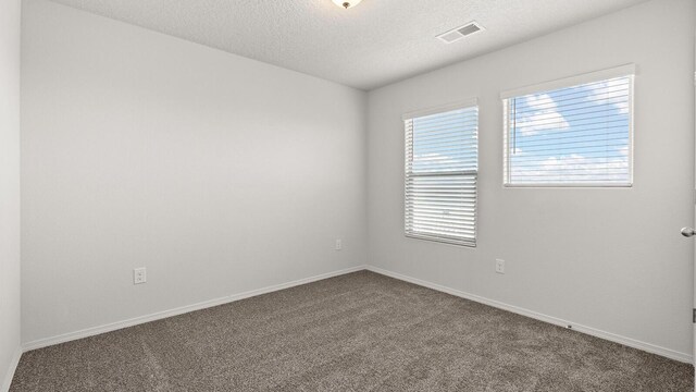 5623 Sagan Loop SE, Albuquerque, NM 87106 - spare room featuring carpet flooring and a textured ceiling