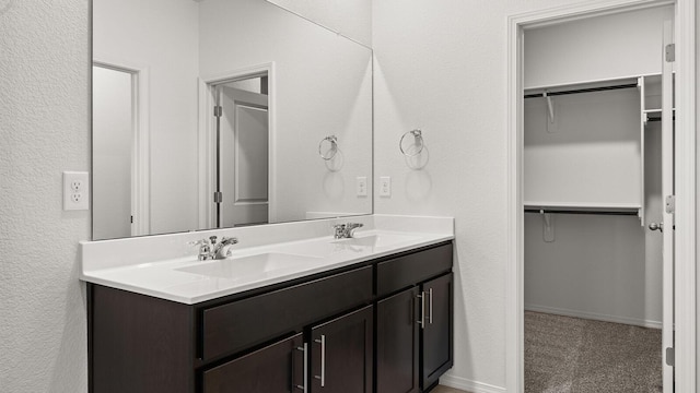 5623 Sagan Loop SE, Albuquerque, NM 87106 - full bath featuring double vanity, a spacious closet, and a textured wall