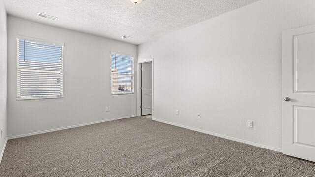 5623 Sagan Loop SE, Albuquerque, NM 87106 - carpeted spare room featuring a textured ceiling and baseboards