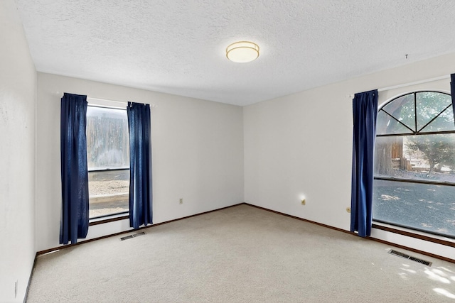 5207 Russell Dr NW, Albuquerque, NM 87114 - carpeted empty room featuring a textured ceiling