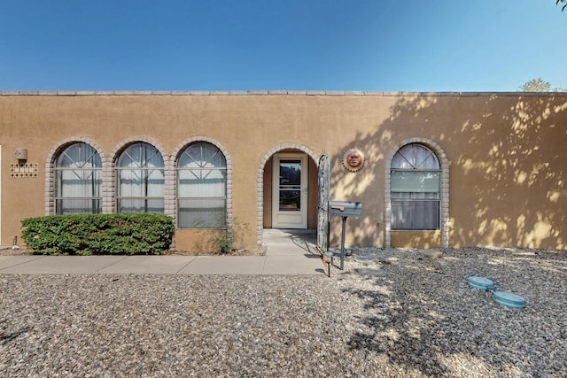 5207 Russell Dr NW, Albuquerque, NM 87114 - property entrance featuring stucco siding