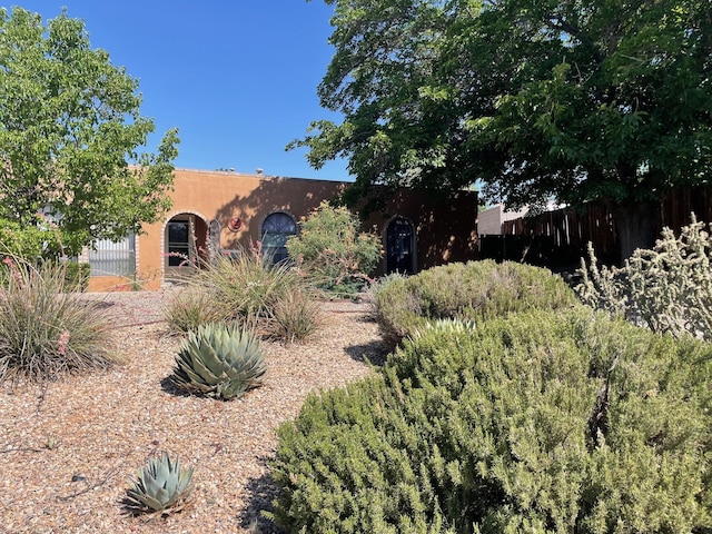5207 Russell Dr NW, Albuquerque, NM 87114 - pueblo revival-style home featuring stucco siding