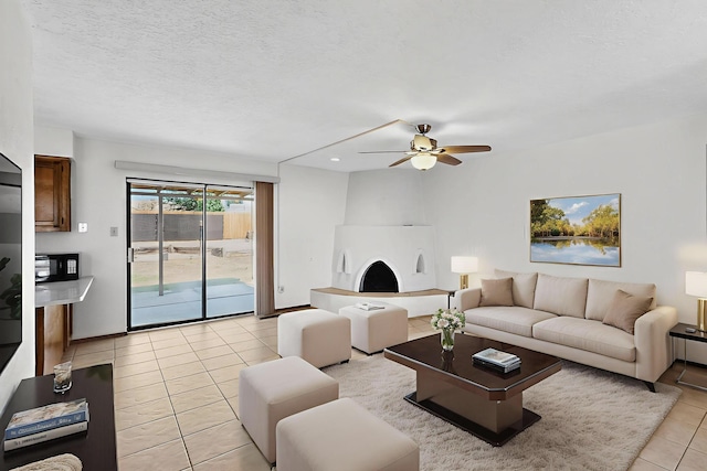 5207 Russell Dr NW, Albuquerque, NM 87114 - living area featuring light tile patterned floors, a ceiling fan, and recessed lighting