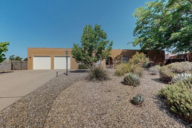 5207 Russell Dr NW, Albuquerque, NM 87114 - southwest-style home featuring stucco siding and driveway