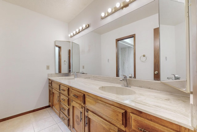 5207 Russell Dr NW, Albuquerque, NM 87114 - full bath with double vanity and tile patterned flooring