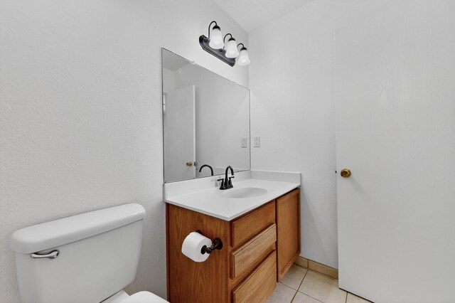 7408 Estes Park Ave NW, Albuquerque, NM 87114 - half bathroom featuring vanity and tile patterned flooring