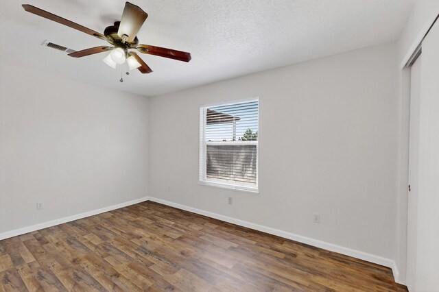 7408 Estes Park Ave NW, Albuquerque, NM 87114 - spare room featuring ceiling fan and wood finished floors