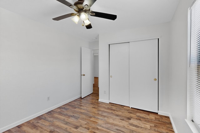 7408 Estes Park Ave NW, Albuquerque, NM 87114 - unfurnished bedroom with wood finished floors, a closet, and ceiling fan
