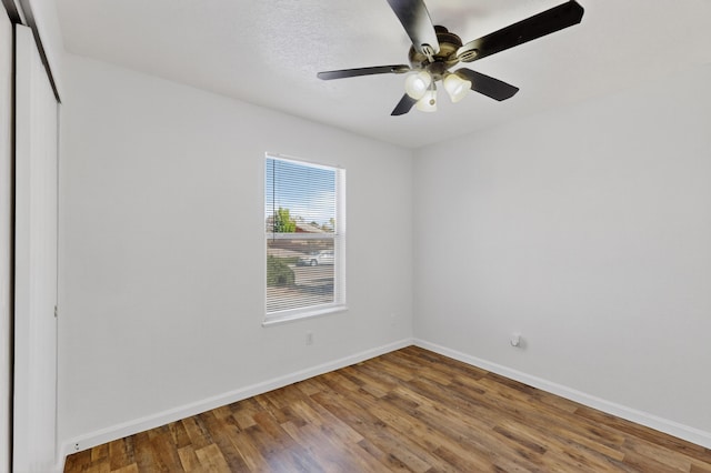 7408 Estes Park Ave NW, Albuquerque, NM 87114 - spare room featuring wood finished floors and a ceiling fan