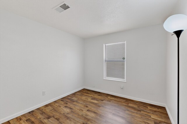7408 Estes Park Ave NW, Albuquerque, NM 87114 - empty room featuring baseboards and wood finished floors