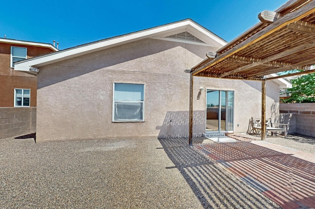 7408 Estes Park Ave NW, Albuquerque, NM 87114 - back of property with stucco siding, a pergola, and a patio area