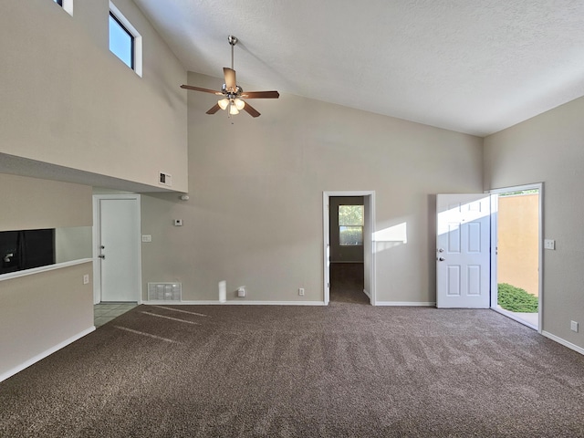 7235 Whippoorwill Ln NE, Albuquerque, NM 87109 - unfurnished living room with carpet floors, a ceiling fan, healthy amount of natural light, and high vaulted ceiling