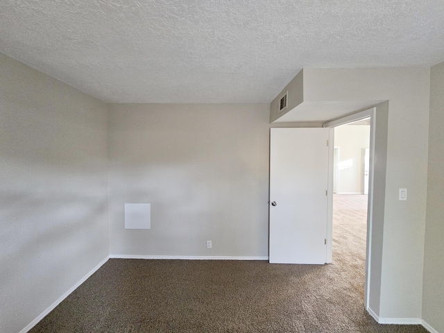 7235 Whippoorwill Ln NE, Albuquerque, NM 87109 - carpeted spare room with baseboards and a textured ceiling