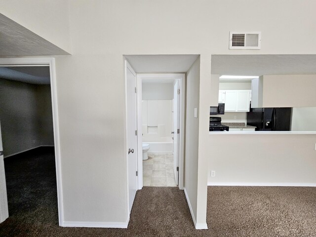 7235 Whippoorwill Ln NE, Albuquerque, NM 87109 - corridor with dark carpet