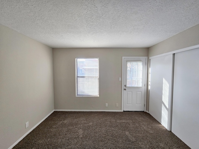 7235 Whippoorwill Ln NE, Albuquerque, NM 87109 - carpeted foyer entrance featuring a textured ceiling