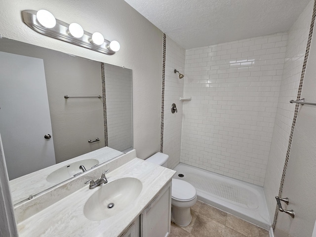 7235 Whippoorwill Ln NE, Albuquerque, NM 87109 - full bath with vanity, tiled shower, and a textured ceiling