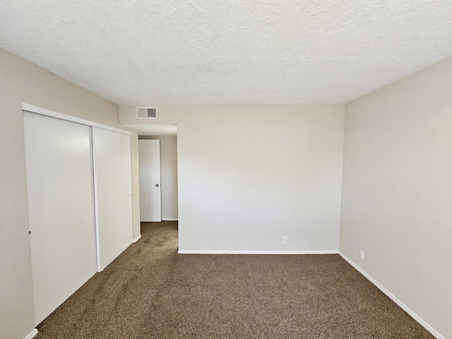 7235 Whippoorwill Ln NE, Albuquerque, NM 87109 - unfurnished bedroom with carpet flooring, a closet, and a textured ceiling