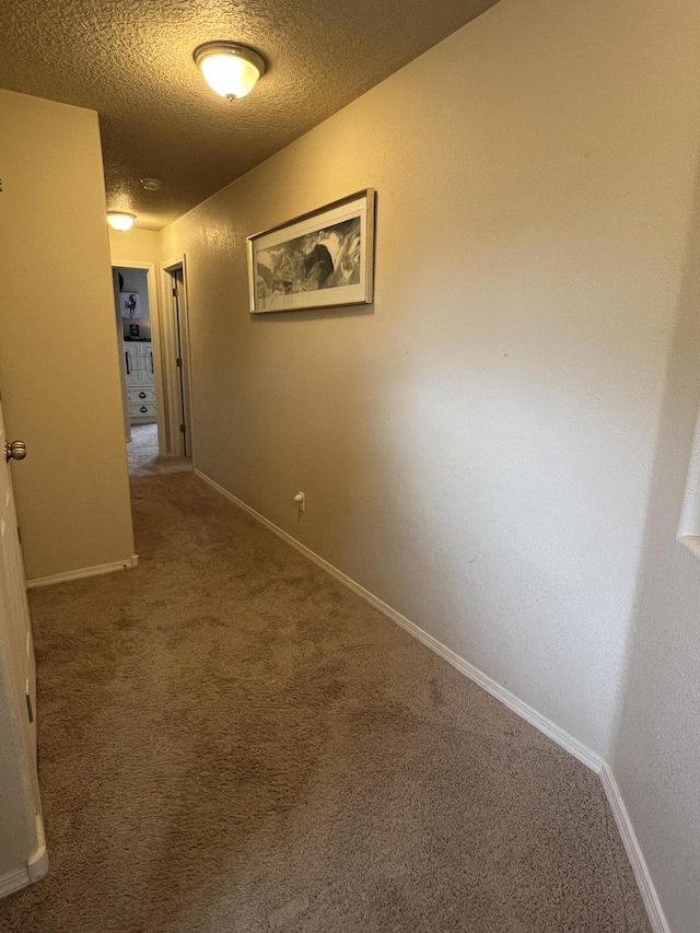 839 Serrano Pointe NW, Albuquerque, NM 87120 - hallway featuring carpet floors and a textured ceiling