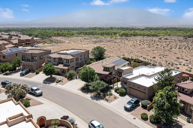 1128 San Augustin Dr, Bernalillo, NM 87004 - aerial perspective of suburban area featuring a mountainous background