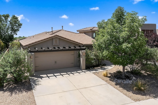 1128 San Augustin Dr, Bernalillo, NM 87004 - view of front of property featuring stucco siding, a tile roof, concrete driveway, and a garage