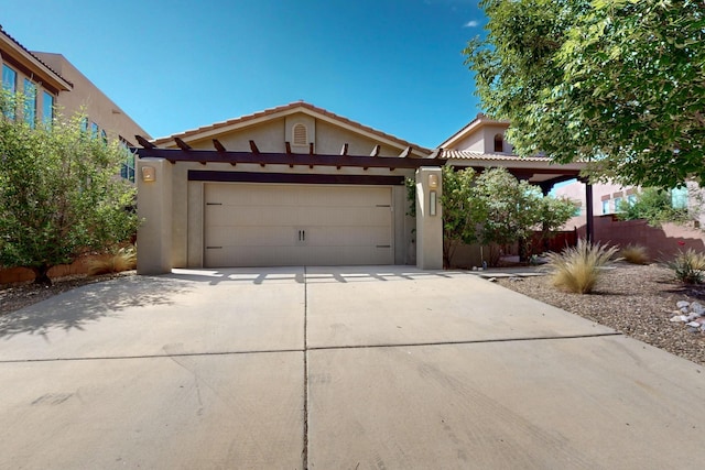 1128 San Augustin Dr, Bernalillo, NM 87004 - view of front of property with an attached garage, stucco siding, driveway, and a tile roof
