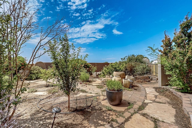 1128 San Augustin Dr, Bernalillo, NM 87004 - fenced backyard featuring a patio