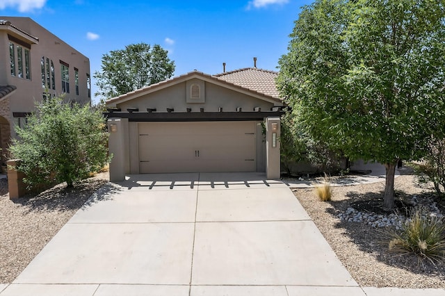 1128 San Augustin Dr, Bernalillo, NM 87004 - view of front of house featuring stucco siding, driveway, a garage, and a tile roof